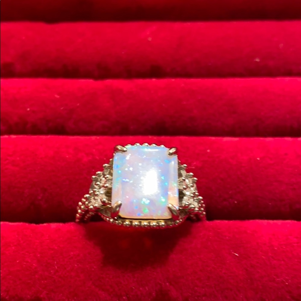 Fire opal stone on a triple plated Rhodium band